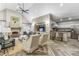 Spacious living room with a vaulted ceiling, fireplace, and a modern kitchen at 211 Colonial Homes Nw Dr # 1105, Atlanta, GA 30309