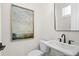 Elegant powder room with pedestal sink and framed mirror at 536 Sawnee Village Blvd # D66, Cumming, GA 30040