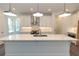 Large kitchen island with white cabinets and stunning quartz countertops at 536 Sawnee Village Blvd # D66, Cumming, GA 30040