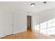 Bedroom with wood floors, neutral walls, and a closet at 6118 Dorsett St, Douglasville, GA 30134