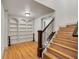 Elegant basement staircase with built-in shelving at 6229 Grand Loop Rd, Sugar Hill, GA 30518