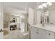 Elegant bathroom with double vanity, large mirror, and tile flooring at 6229 Grand Loop Rd, Sugar Hill, GA 30518