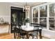 Bright dining area with a marble top table and black chairs near the kitchen at 6229 Grand Loop Rd, Sugar Hill, GA 30518