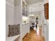 White entryway with built-in bench, cabinets, and view of the dining room at 6229 Grand Loop Rd, Sugar Hill, GA 30518