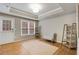 Spacious living room featuring hardwood floors and a neutral color scheme at 6229 Grand Loop Rd, Sugar Hill, GA 30518