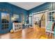 ' playroom with blue walls and French doors leading to other rooms at 6229 Grand Loop Rd, Sugar Hill, GA 30518