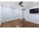 Light blue bedroom with hardwood floors and ceiling fan at 818 Highland Green Ne Way # 818, Atlanta, GA 30306