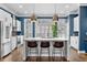 Stylish kitchen with white cabinets, stainless steel appliances and blue walls at 818 Highland Green Ne Way # 818, Atlanta, GA 30306