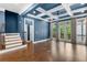 Open living room with hardwood floors, stairs, and blue walls at 818 Highland Green Ne Way # 818, Atlanta, GA 30306