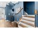 Elegant staircase with dark wood steps and wrought iron railing at 818 Highland Green Ne Way # 818, Atlanta, GA 30306