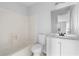 Bathroom featuring a shower-tub combo and vanity sink at 8168 Canyon Forge Dr, Riverdale, GA 30274