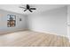 Bedroom featuring wood-look floors and a ceiling fan at 8168 Canyon Forge Dr, Riverdale, GA 30274