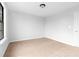 Cozy bedroom featuring neutral carpet and a ceiling light at 8168 Canyon Forge Dr, Riverdale, GA 30274