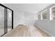 The bedroom features fresh paint, wood floors, ample light, and new base trim at 8168 Canyon Forge Dr, Riverdale, GA 30274