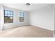 Bedroom with plush carpeting and natural light at 8168 Canyon Forge Dr, Riverdale, GA 30274