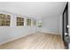 Bright living room with hardwood floors and multiple windows at 8168 Canyon Forge Dr, Riverdale, GA 30274
