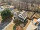 Aerial shot of house featuring a well-manicured lawn, private driveway, and lush surroundings at 232 Taylors Farm Dr, Canton, GA 30115