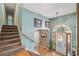 Bright entryway with staircase, hardwood floors and neutral-toned walls at 232 Taylors Farm Dr, Canton, GA 30115