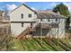 Exterior view of a charming two-story home with a spacious wooden deck and backyard at 232 Taylors Farm Dr, Canton, GA 30115