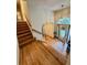 Inviting foyer featuring hardwood floors and a staircase with a decorative front door at 232 Taylors Farm Dr, Canton, GA 30115