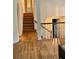 Bright foyer featuring hardwood floors and staircase with white railing at 232 Taylors Farm Dr, Canton, GA 30115