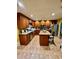 Bright kitchen with wooden cabinets, stainless steel appliances, granite counters, and central island at 232 Taylors Farm Dr, Canton, GA 30115