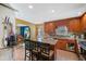 Kitchen with granite countertops, wooden cabinets, and an island at 232 Taylors Farm Dr, Canton, GA 30115