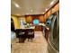 Bright kitchen with wooden cabinets, stainless steel appliances, granite counters, and central island at 232 Taylors Farm Dr, Canton, GA 30115