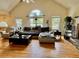 Bright and airy living room with hardwood floors, vaulted ceilings, and large windows at 232 Taylors Farm Dr, Canton, GA 30115