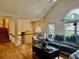 Cozy living room featuring hardwood floors, arched entryways, and lots of natural light at 232 Taylors Farm Dr, Canton, GA 30115