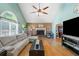 Bright living room with vaulted ceilings, hardwood floors, and a fireplace at 232 Taylors Farm Dr, Canton, GA 30115
