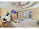 A spacious primary bedroom featuring a tray ceiling, ceiling fan, and neutral decor at 232 Taylors Farm Dr, Canton, GA 30115