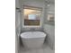 Modern bathroom with a free-standing tub at 235 Prestwyck Oak, Lawrenceville, GA 30043