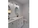 Double vanity bathroom with white cabinets and quartz countertops at 235 Prestwyck Oak, Lawrenceville, GA 30043