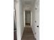 Bright hallway with hardwood floors and neutral paint at 235 Prestwyck Oak, Lawrenceville, GA 30043