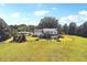 Aerial view of a two-story modern farmhouse with a large backyard at 3842 Ernest W Barrett Sw Pkwy, Marietta, GA 30064