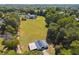 Aerial view of property showing house, barn, and expansive land at 3842 Ernest W Barrett Sw Pkwy, Marietta, GA 30064