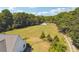 Aerial view of property showing house, expansive yard, and outbuildings at 3842 Ernest W Barrett Sw Pkwy, Marietta, GA 30064