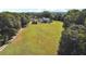 Aerial view of home with expansive backyard and wooden fence at 3842 Ernest W Barrett Sw Pkwy, Marietta, GA 30064