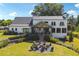 Aerial view of home with backyard firepit and patio at 3842 Ernest W Barrett Sw Pkwy, Marietta, GA 30064