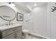 Basement bathroom with white subway tile shower and gray vanity at 3842 Ernest W Barrett Sw Pkwy, Marietta, GA 30064