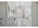 Large bathroom with marble floors and soaking tub at 3842 Ernest W Barrett Sw Pkwy, Marietta, GA 30064