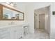 Elegant bathroom with white cabinetry, marble flooring, and a walk-in shower at 3842 Ernest W Barrett Sw Pkwy, Marietta, GA 30064