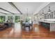 Open concept dining room with hardwood floors and a large farmhouse table at 3842 Ernest W Barrett Sw Pkwy, Marietta, GA 30064