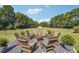 Relaxing fire pit area with wooden chairs, perfect for outdoor gatherings at 3842 Ernest W Barrett Sw Pkwy, Marietta, GA 30064