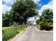 Modern farmhouse with long driveway and landscaping at 3842 Ernest W Barrett Sw Pkwy, Marietta, GA 30064