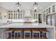 Gourmet kitchen featuring a large marble island and glass-front cabinets at 3842 Ernest W Barrett Sw Pkwy, Marietta, GA 30064