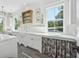 Bright laundry room with white cabinets and farmhouse sink at 3842 Ernest W Barrett Sw Pkwy, Marietta, GA 30064