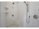 Walk-in shower with white tile and built-in seat at 3842 Ernest W Barrett Sw Pkwy, Marietta, GA 30064