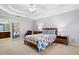 Main bedroom with carpeted floor, wood furniture, and ensuite bath at 4698 Norman Nw Dr, Kennesaw, GA 30144